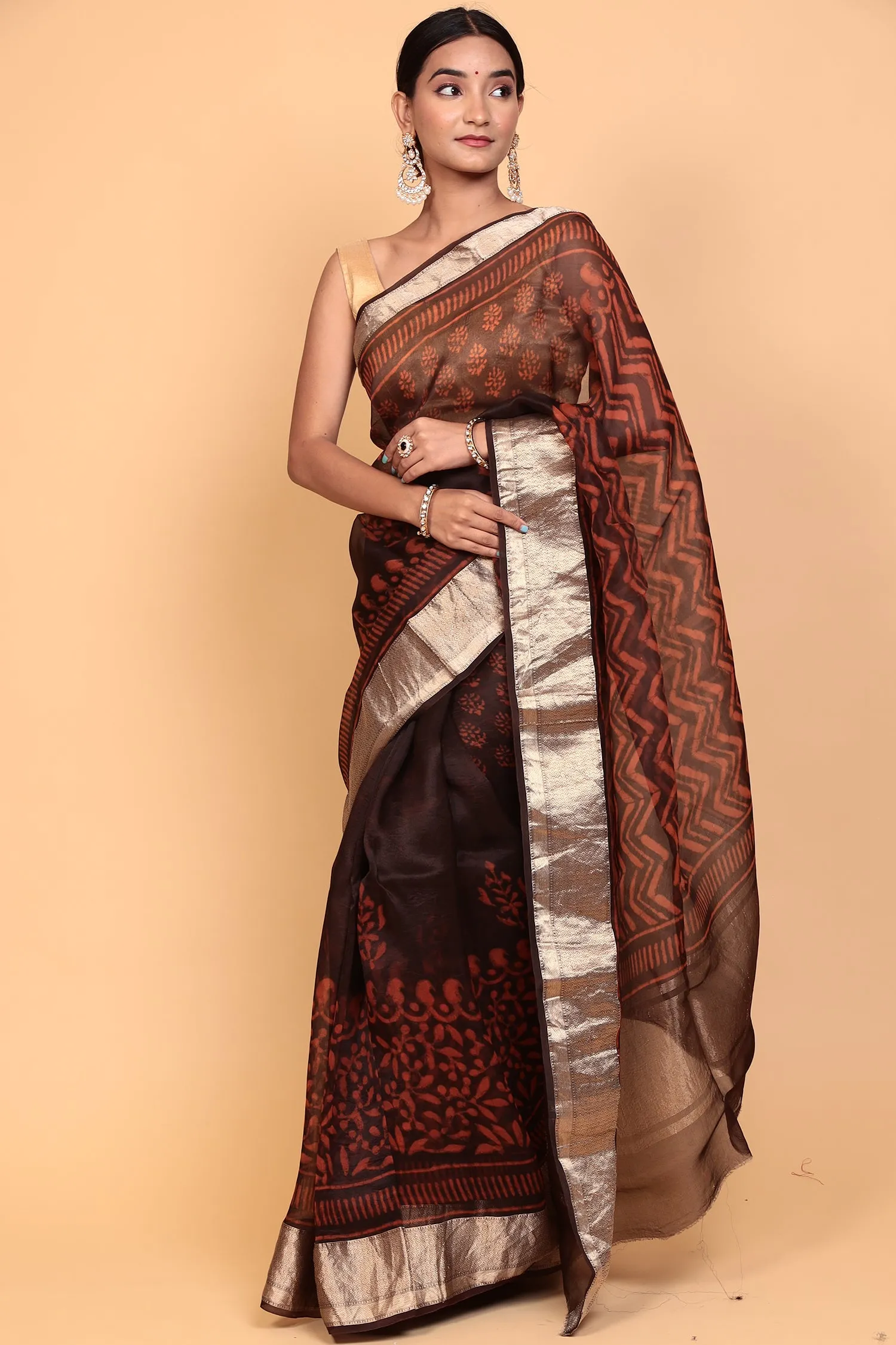 Dabu print Organza Saree with Zari work.